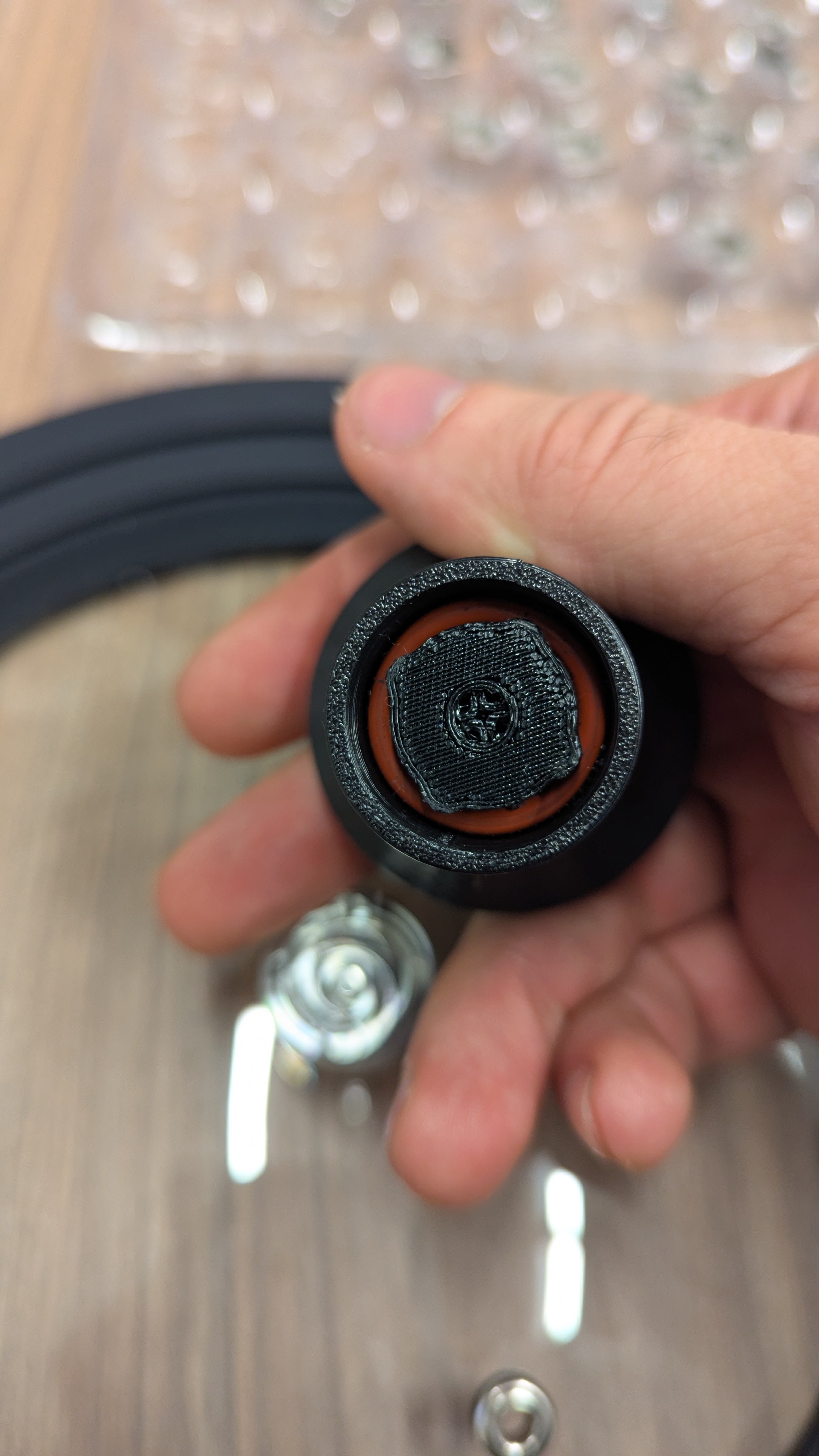 Pressing handle onto Liddy Lid to set O-ring behind 4 tabs